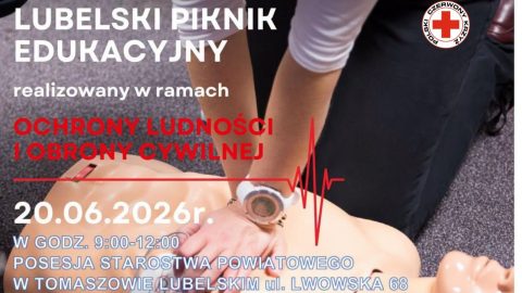 Plakat informujący o Lubelskim Pikniku Edukacyjnym w ramach Akademii Ochrony Ludności i Obrony Cywilnej. Na zdjęciu ratownik wykonuje resuscytację krążeniowo-oddechową na fantomie. Wydarzenie odbędzie się 20 czerwca 2026 r. w godz. 9:00–12:00 na terenie Starostwa Powiatowego w Tomaszowie Lubelskim przy ul. Lwowskiej 68. Na plakacie znajdują się logotypy służb ratowniczych, Policji, PCK, numeru alarmowego 112 oraz Ministerstwa Spraw Wewnętrznych i Administracji.