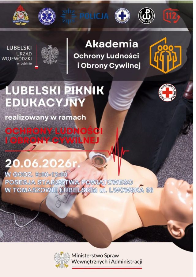 Plakat informujący o Lubelskim Pikniku Edukacyjnym w ramach Akademii Ochrony Ludności i Obrony Cywilnej. Na zdjęciu ratownik wykonuje resuscytację krążeniowo-oddechową na fantomie. Wydarzenie odbędzie się 20 czerwca 2026 r. w godz. 9:00–12:00 na terenie Starostwa Powiatowego w Tomaszowie Lubelskim przy ul. Lwowskiej 68. Na plakacie znajdują się logotypy służb ratowniczych, Policji, PCK, numeru alarmowego 112 oraz Ministerstwa Spraw Wewnętrznych i Administracji.