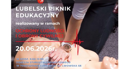 Plakat informujący o Lubelskim Pikniku Edukacyjnym w ramach Akademii Ochrony Ludności i Obrony Cywilnej. Na zdjęciu ratownik wykonuje resuscytację krążeniowo-oddechową na fantomie. Wydarzenie odbędzie się 20 czerwca 2026 r. w godz. 9:00–12:00 na terenie Starostwa Powiatowego w Tomaszowie Lubelskim przy ul. Lwowskiej 68. Na plakacie znajdują się logotypy służb ratowniczych, Policji, PCK, numeru alarmowego 112 oraz Ministerstwa Spraw Wewnętrznych i Administracji.