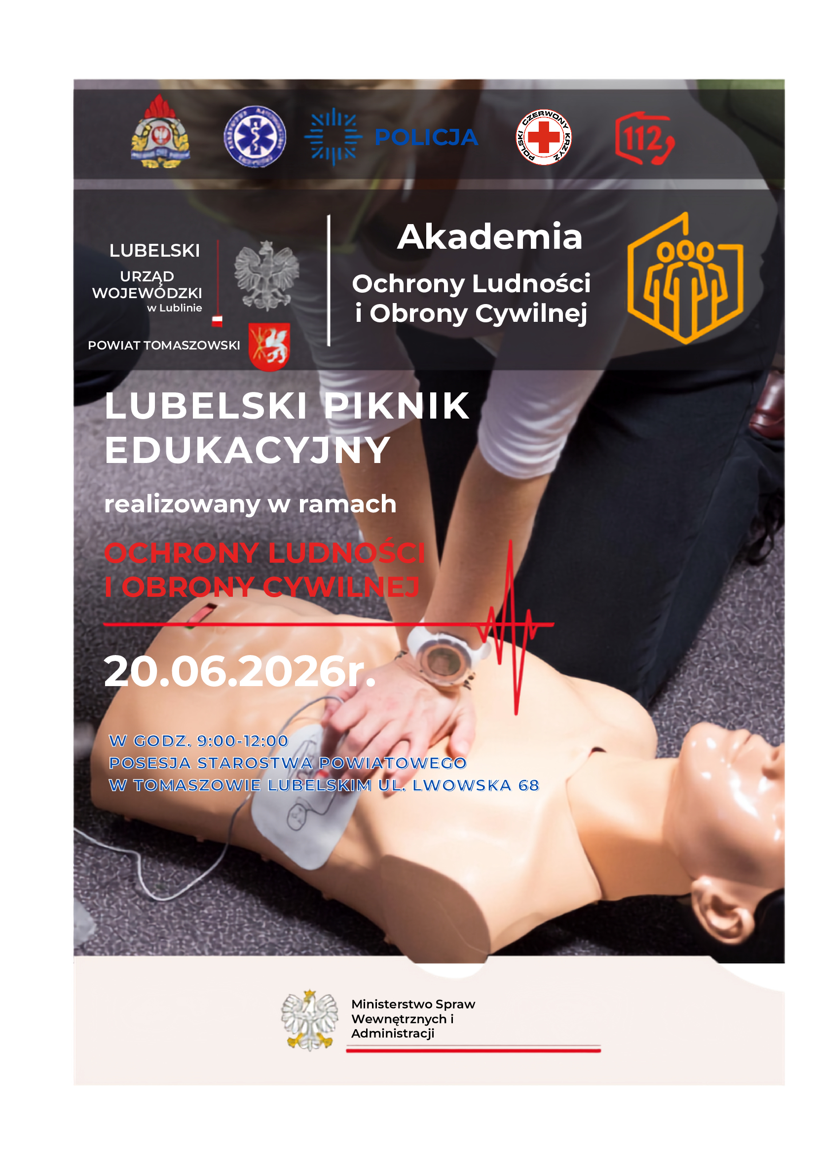 Plakat informujący o Lubelskim Pikniku Edukacyjnym w ramach Akademii Ochrony Ludności i Obrony Cywilnej. Na zdjęciu ratownik wykonuje resuscytację krążeniowo-oddechową na fantomie. Wydarzenie odbędzie się 20 czerwca 2026 r. w godz. 9:00–12:00 na terenie Starostwa Powiatowego w Tomaszowie Lubelskim przy ul. Lwowskiej 68. Na plakacie znajdują się logotypy służb ratowniczych, Policji, PCK, numeru alarmowego 112 oraz Ministerstwa Spraw Wewnętrznych i Administracji.